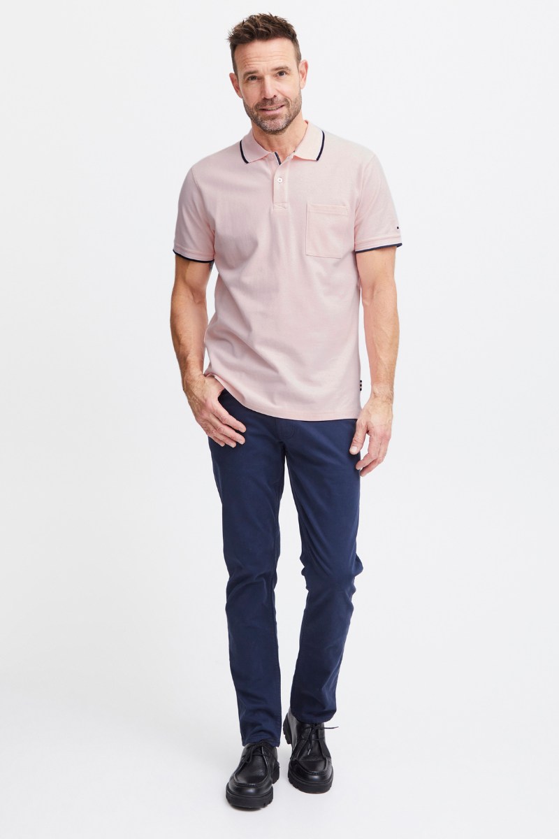Pink polo shirt and navy chinos